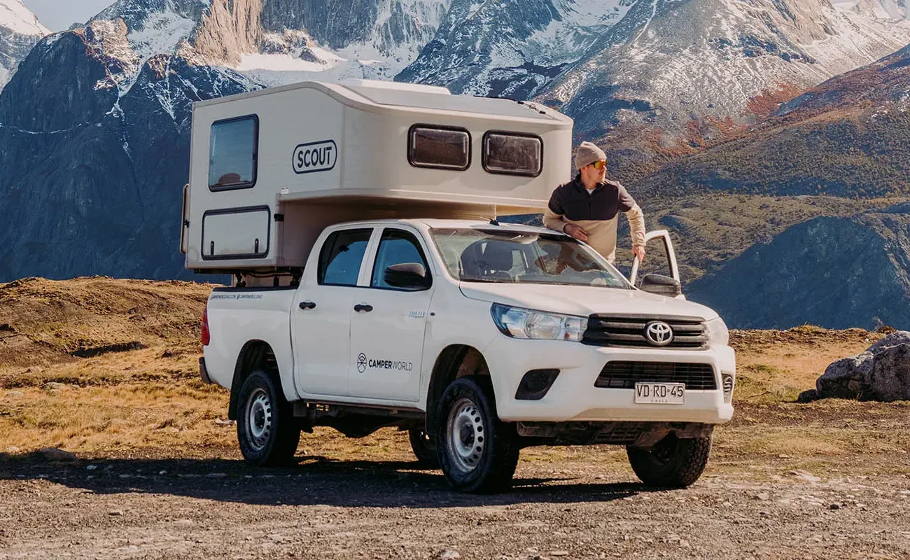 Yoho camper on a Toyota Hilux facing the mountains