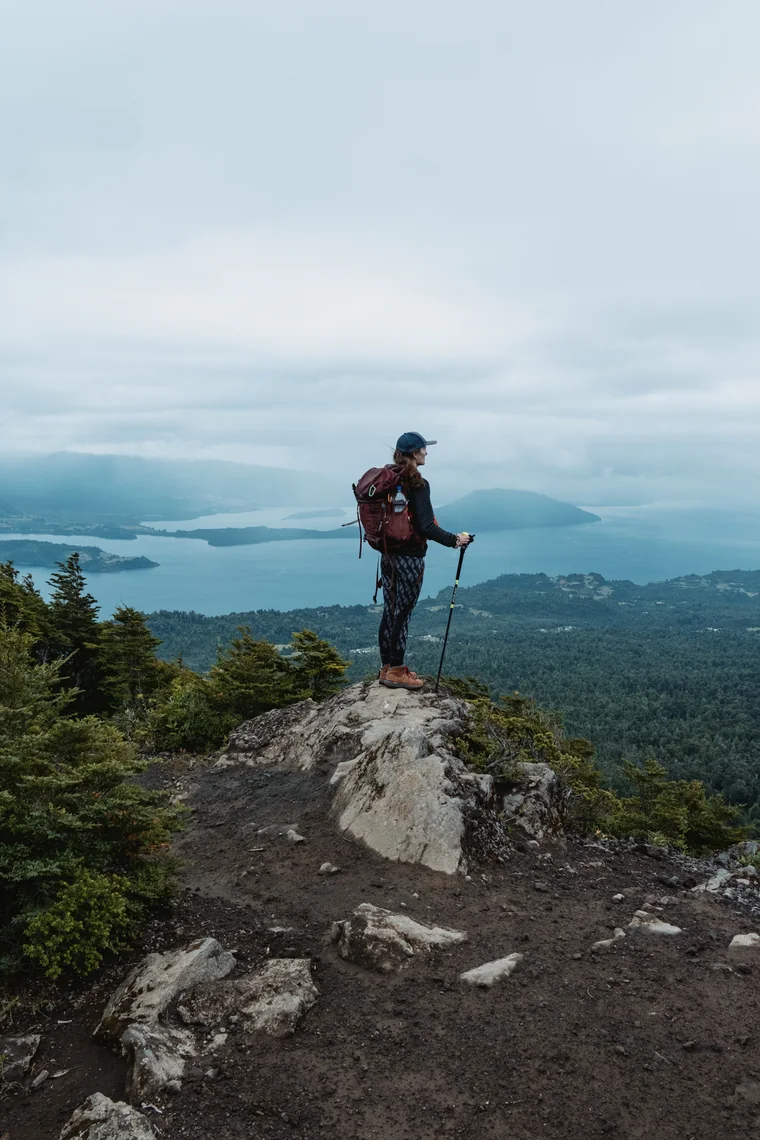 Hiker looking at the lake from the summit