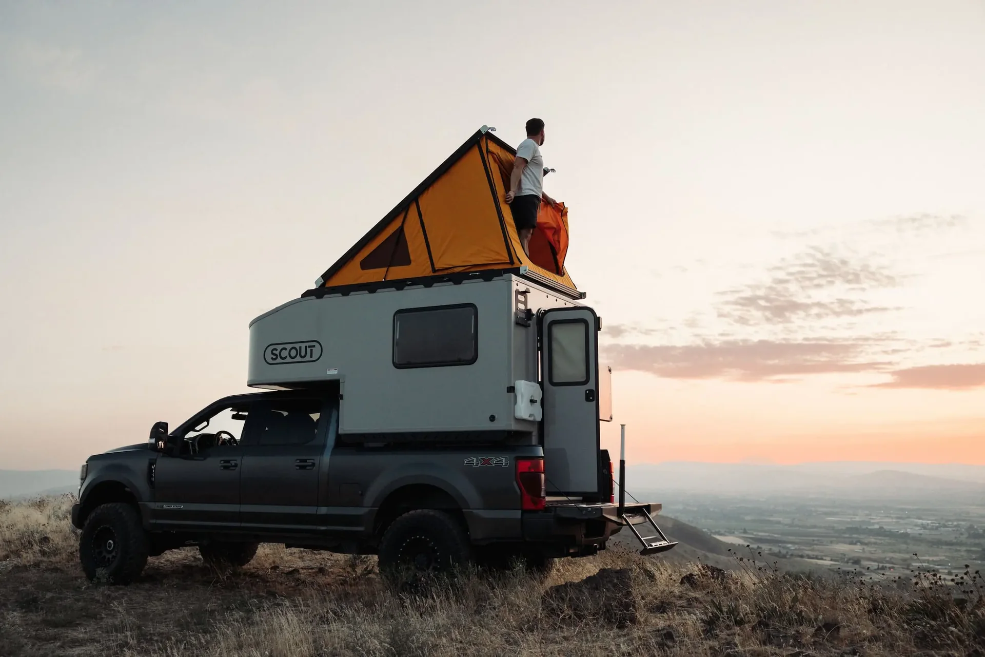 Scout Olympic with the roof top tent open at sunset
