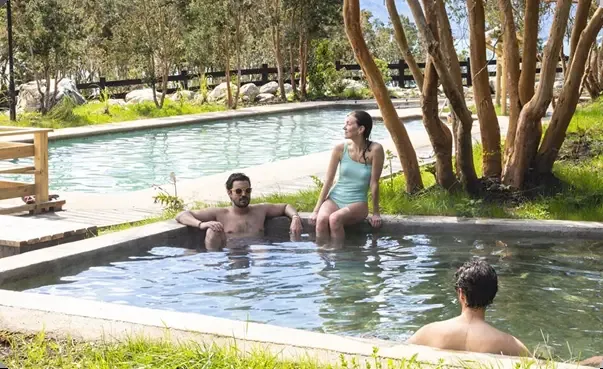 People in the Cochamó hot spring pools