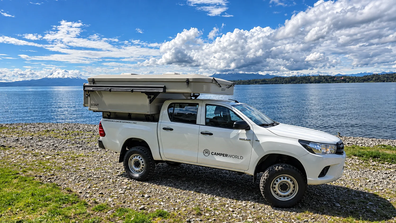 Yoho Pop-Up, closed, on a Toyota Hilux facing a lake