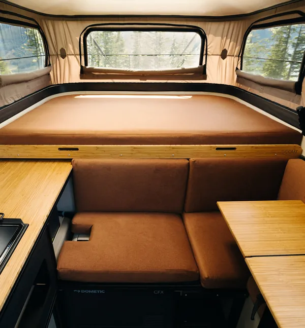 Inside the Yoho Pop-Up, with the bed and dinette