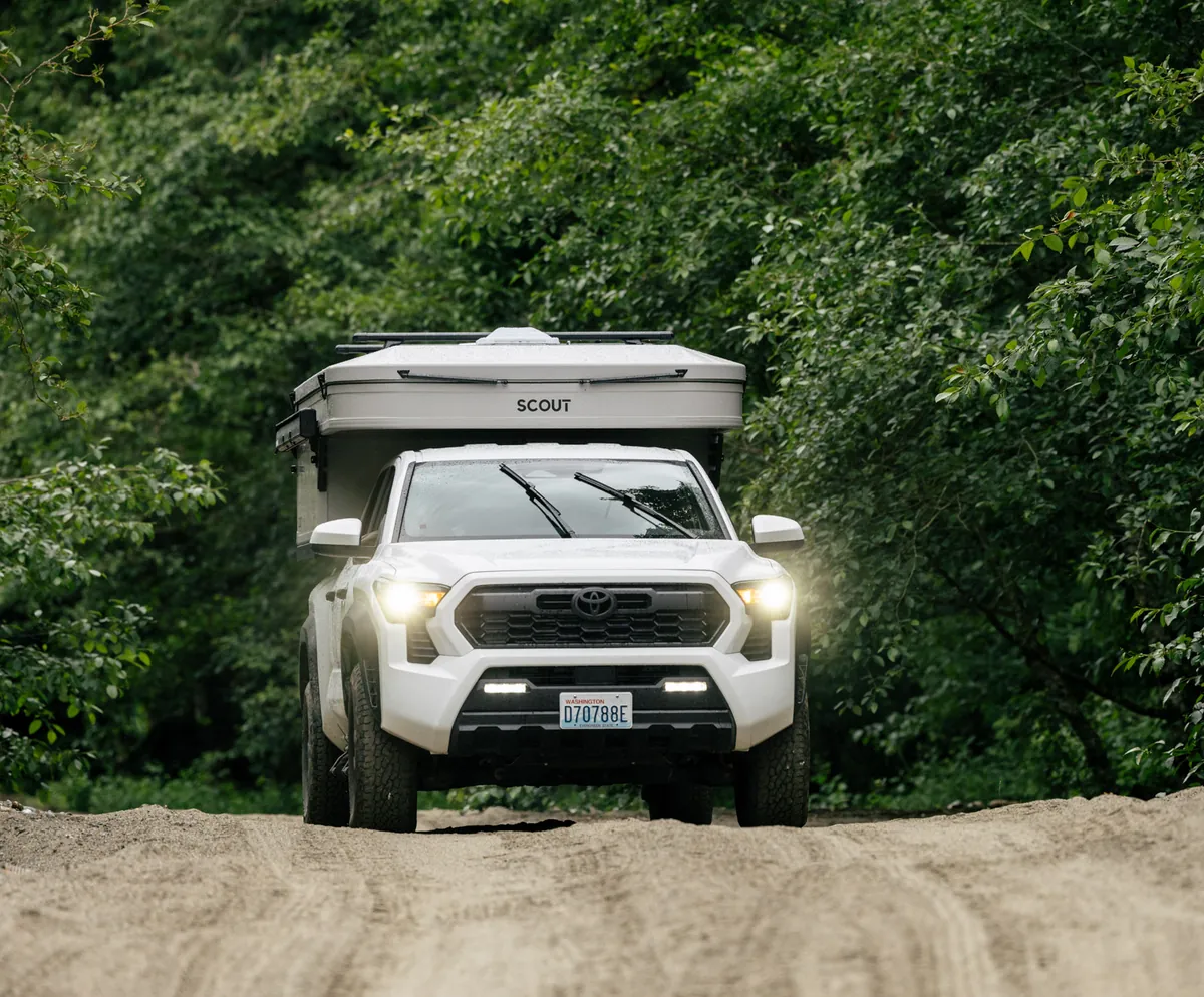 Yoho Pop-Up on a pickup climbing a dirt road